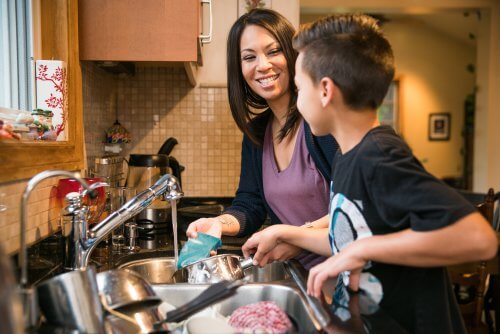 family cleaning kitchen