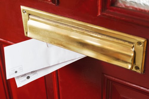 slightly tarnished brass letterbox