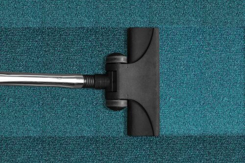 Vacuuming blue carpet