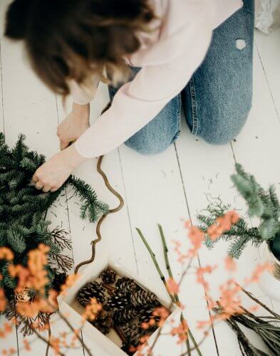 lady taking down Christmas decorations