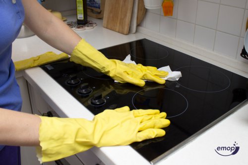 cleaner wiping surface of cooker